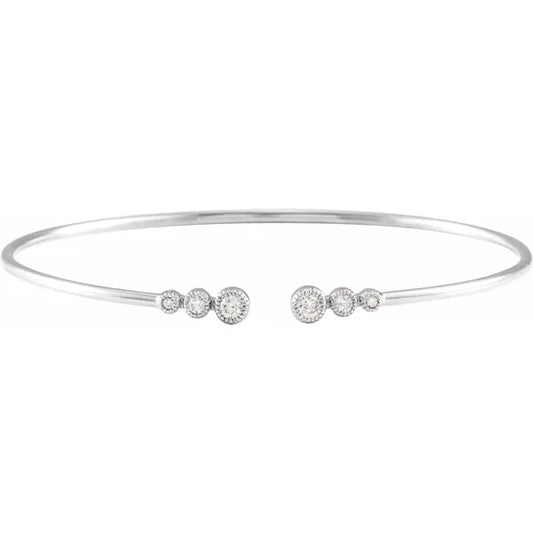 White gold diamond bangle bracelet on a white background