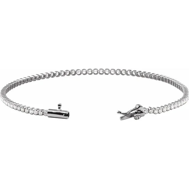 Silver diamond tennis bracelet with a clasp on a white background