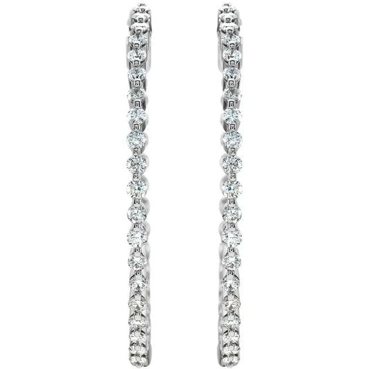 White gold diamond hoop earring on a white background