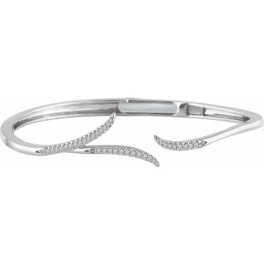 White gold diamond vine bangle bracelet on a white background.