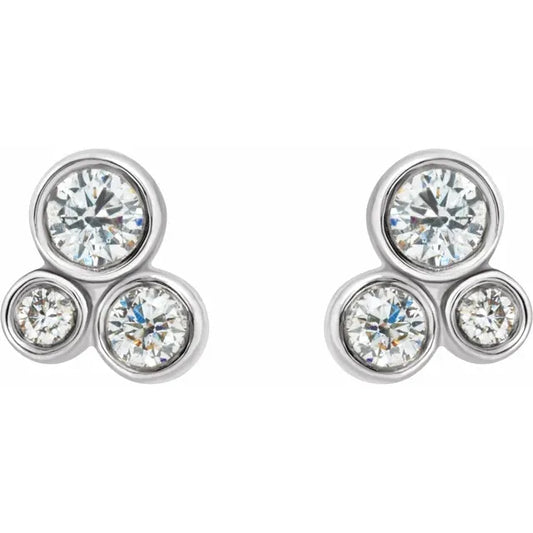 White gold diamond stud earrings on a white background.