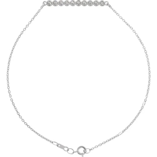Silver diamond bar bracelet with a chain link design on a white background