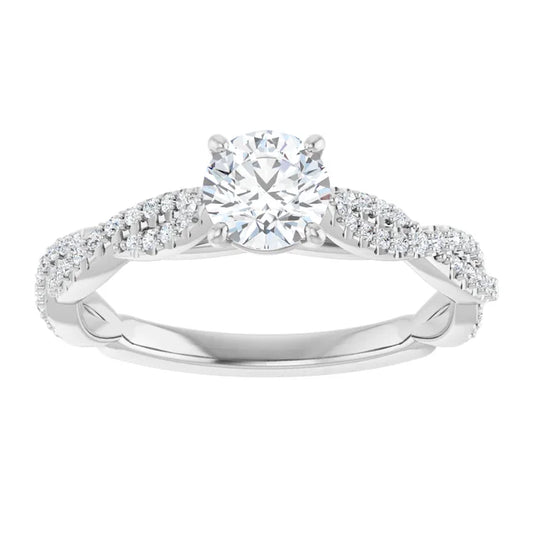 White gold diamond engagement ring with a twisted band on a white background.