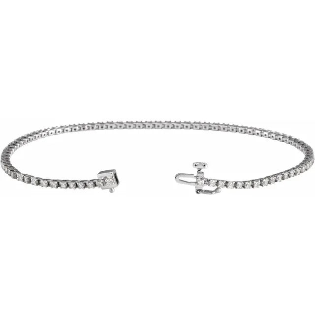 Silver tennis bracelet with a clasp on a white background