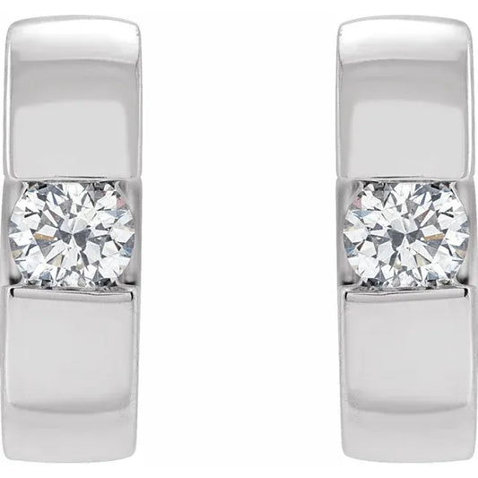 White gold diamond hoop earrings on a white background