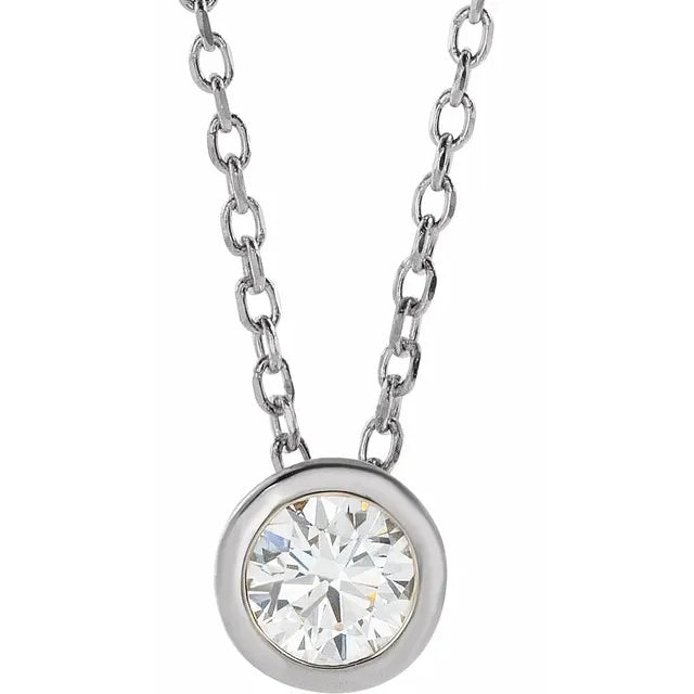 White gold bezel-set diamond pendant necklace on a white background.