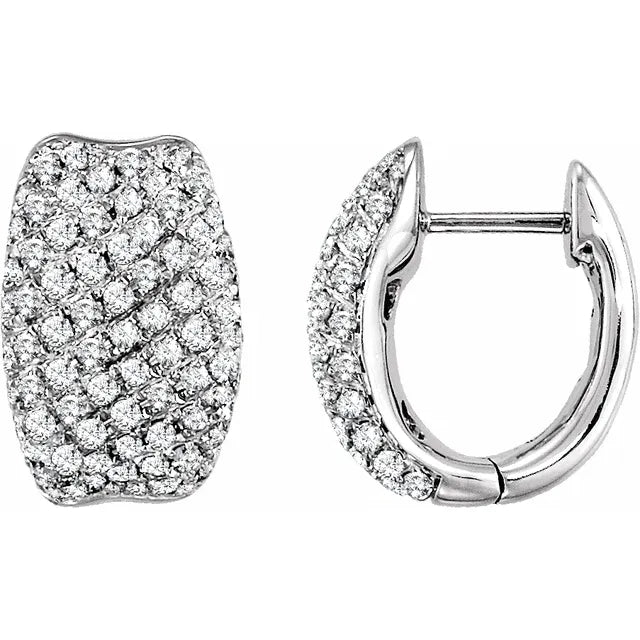 Pair of silver hoop earrings covered in diamonds. The background is white.