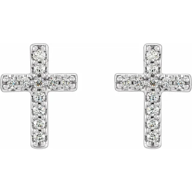 White gold diamond cross stud earrings on a white background.