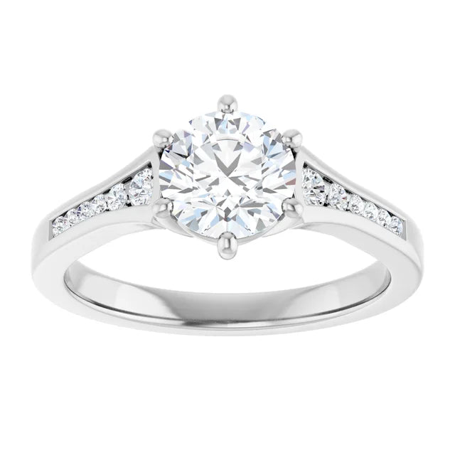 White gold diamond engagement ring with a diamond band on a white background.