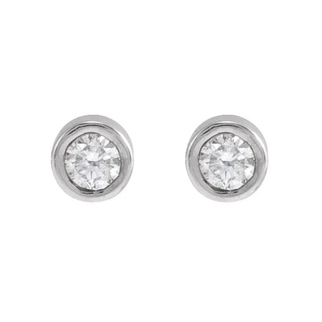 White gold diamond stud earrings on a white background