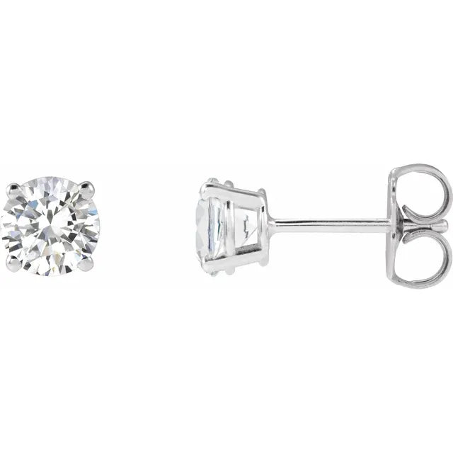 Pair of diamond stud earrings on a white background