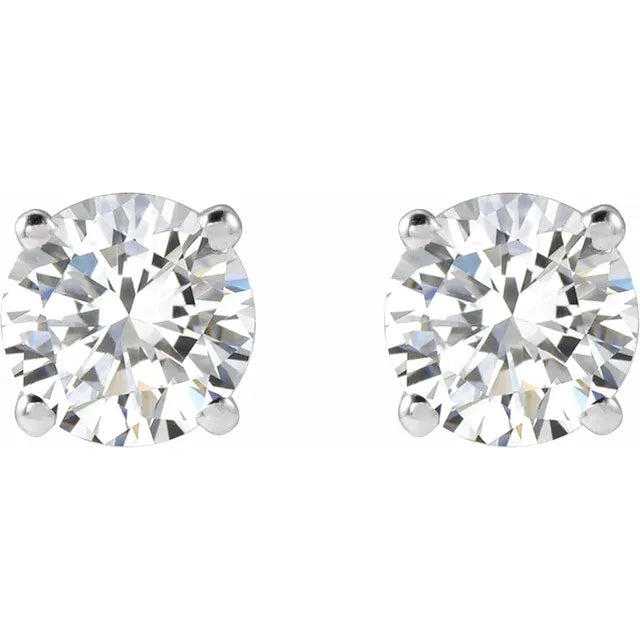 Pair of diamond stud earrings on a white background