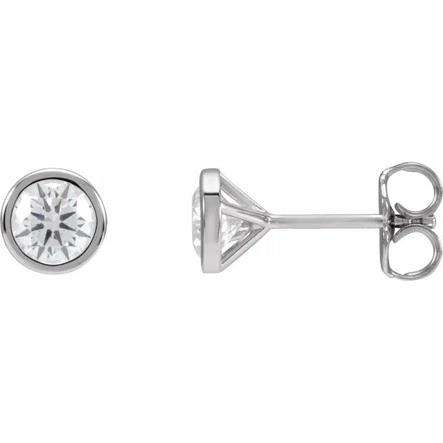 Pair of round diamond stud earrings in white gold, on a white background.