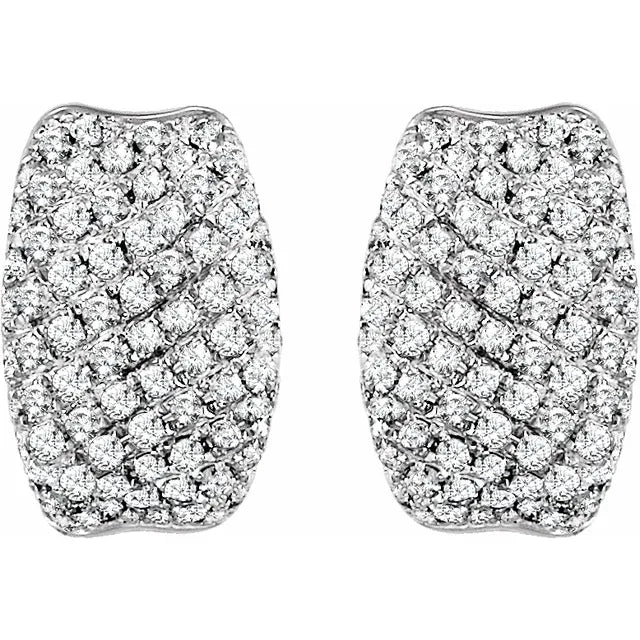 White gold diamond huggie earrings on a white background