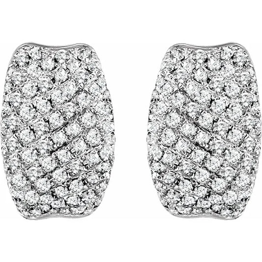 White gold diamond huggie earrings on a white background