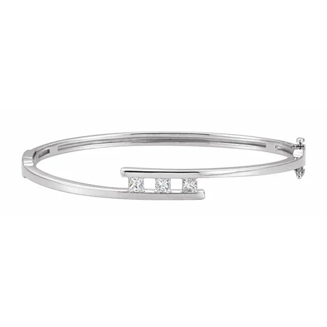 White gold diamond bangle bracelet on a white background.