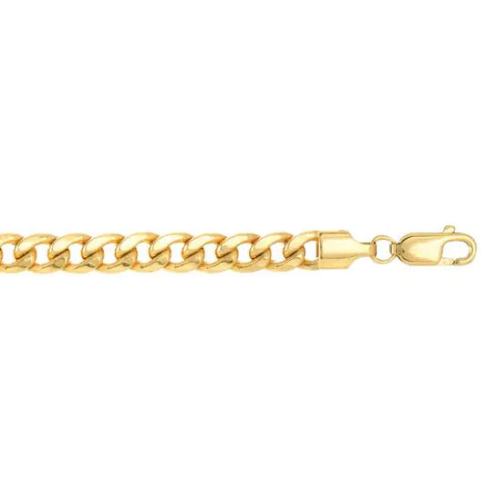 Yellow gold cuban link chain on a white background.