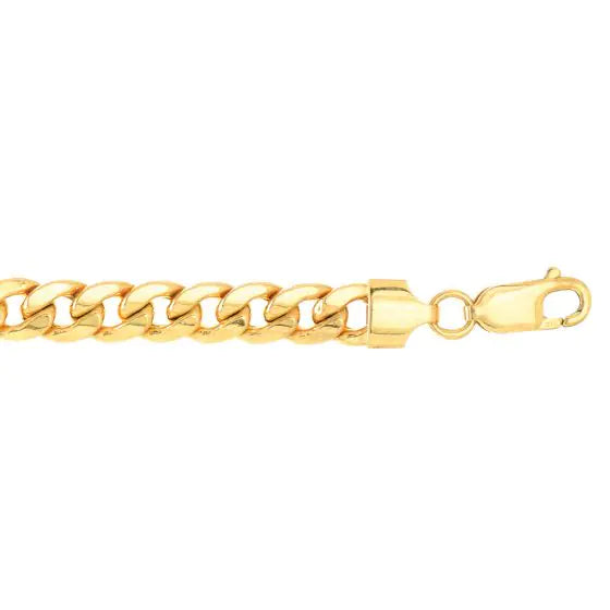 Yellow gold cuban link chain on a white background.