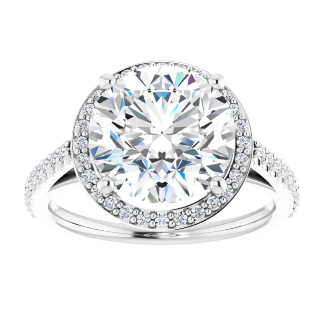 Silver diamond engagement ring with a halo setting and diamond-studded band