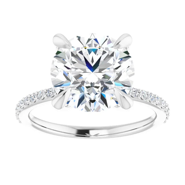 Oval-cut diamond engagement ring with a prong setting and diamond-studded band