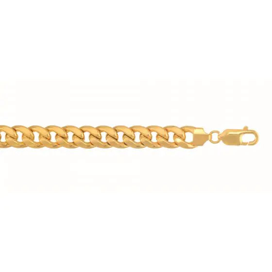 Yellow gold cuban link chain on a white background.