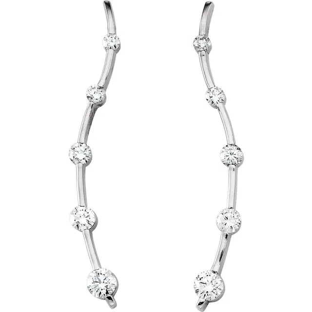 White gold diamond climber earrings on a white background