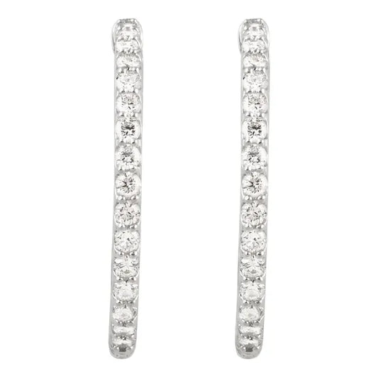 White gold diamond hoop earrings on a white background.