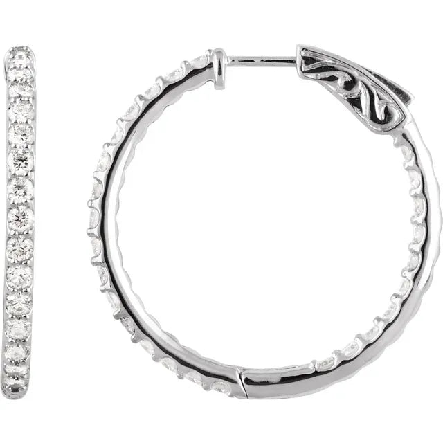 White gold diamond hoop earrings on a white background.