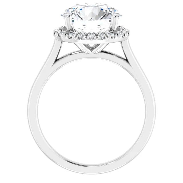 French-set halo-style engagement ring with a round-cut center stone on a white background