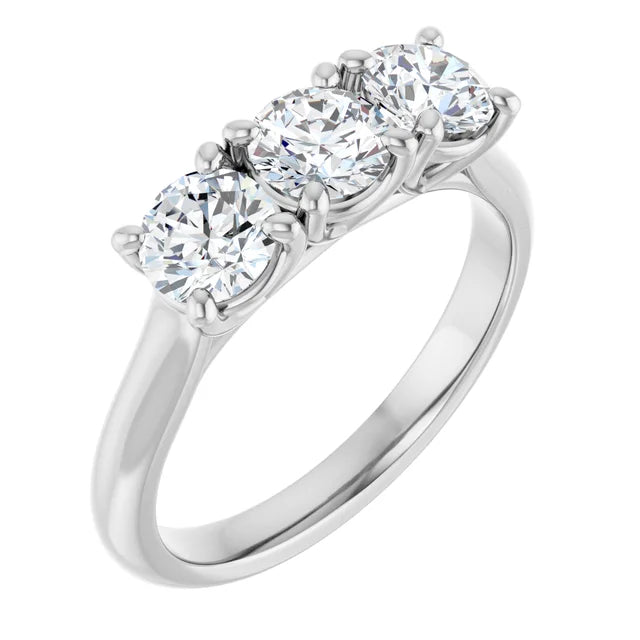 Three-stone diamond engagement ring with a shared prong setting