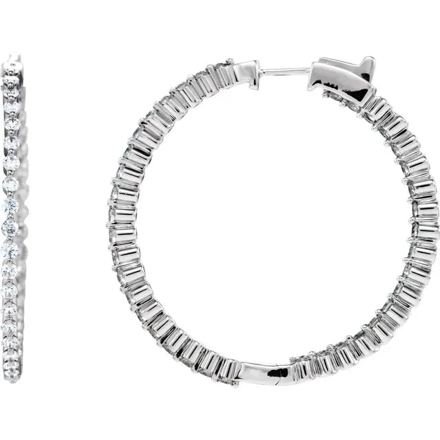 White gold diamond hoop earring on a white background