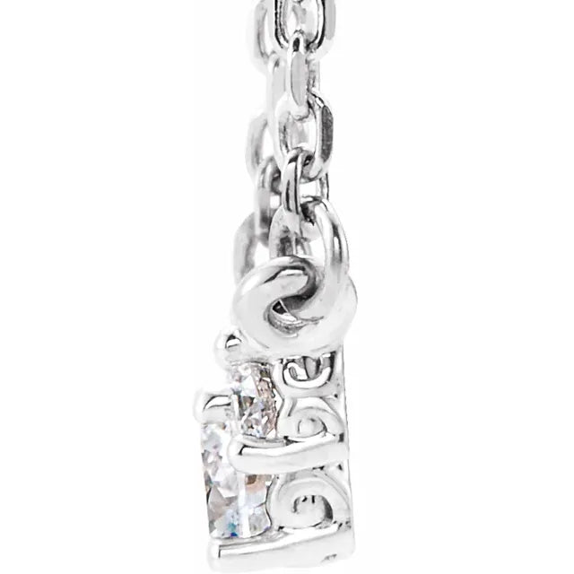 14K white gold necklace three-stone diamond pendant on a white background