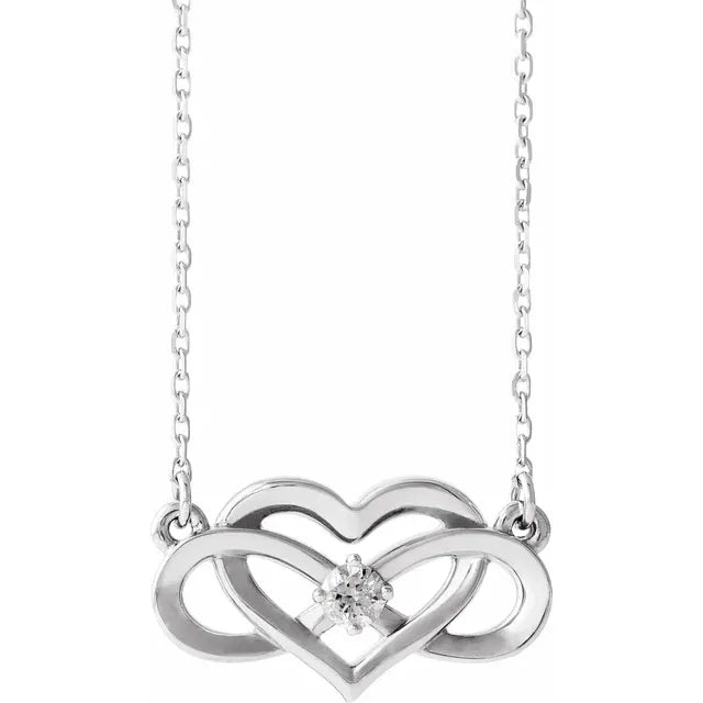 White gold diamond infinity heart necklace on a white background.