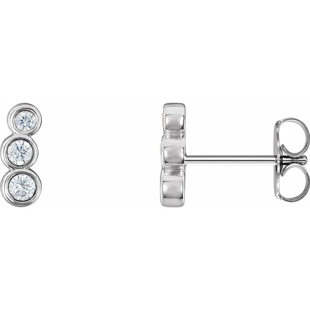 Pair of white gold diamond ear stud earrings on a white background