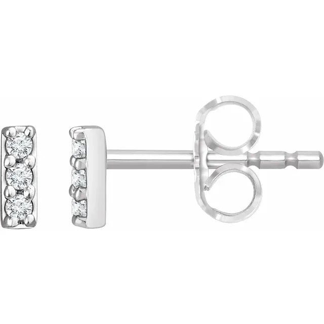 White gold diamond stud earrings on a white background.