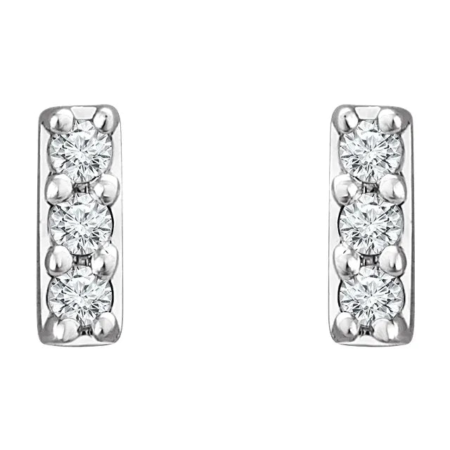 White gold diamond stud earrings on a white background.