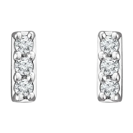 White gold diamond stud earrings on a white background.