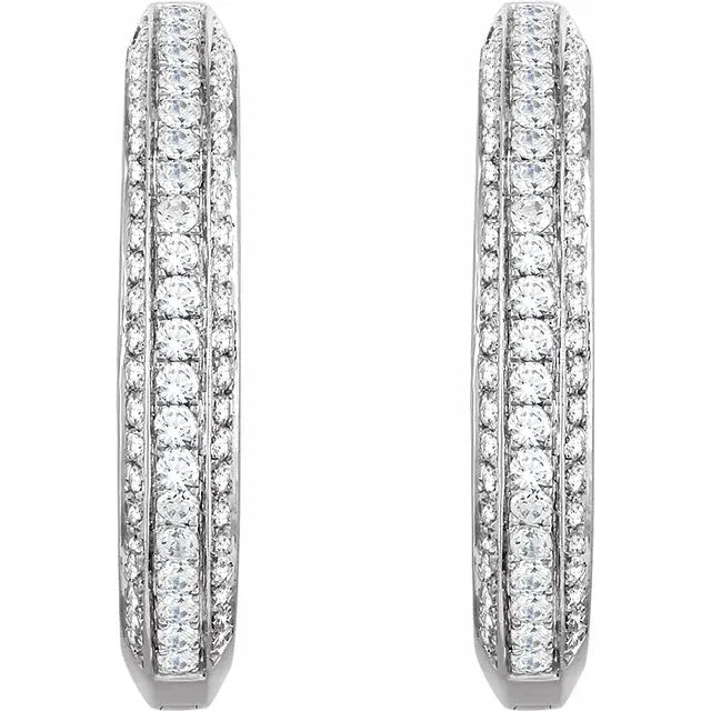 Pair of silver hoop earrings with diamonds encrusted along the front. The background is white.