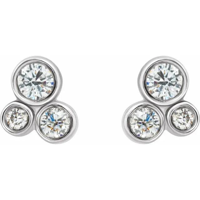 White gold diamond stud earrings on a white background.