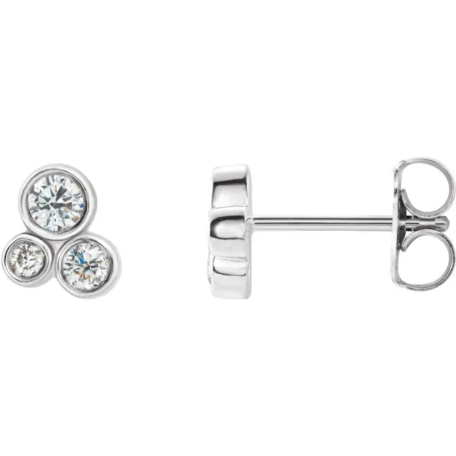 White gold diamond stud earrings on a white background.