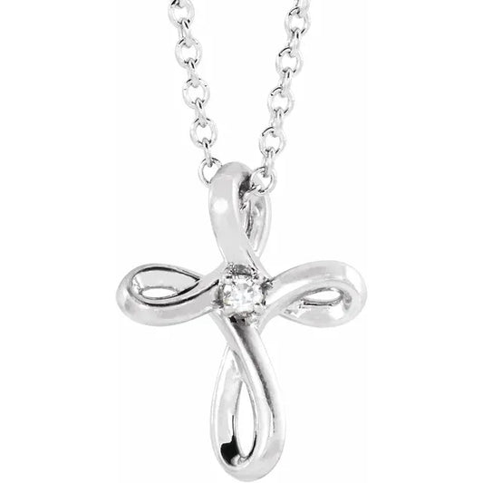 White gold diamond cross necklace on a white background