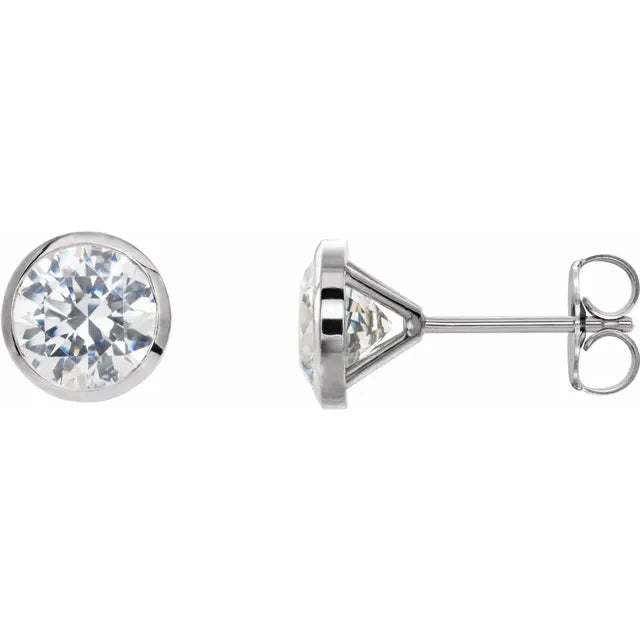 White gold diamond stud earrings on a white background