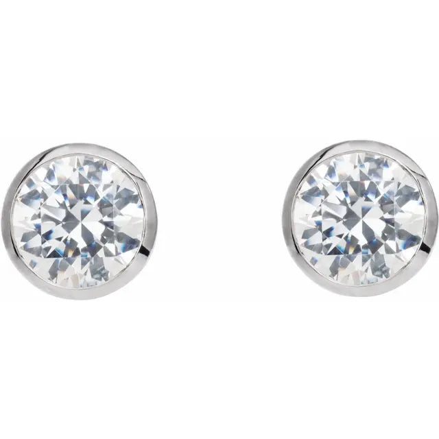 White gold diamond stud earrings on a white background