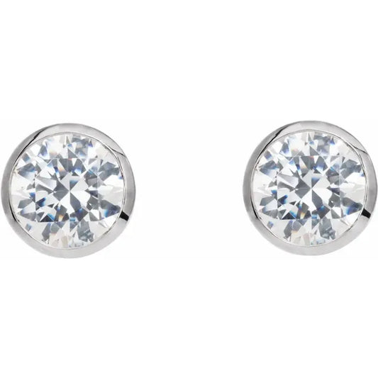 White gold diamond stud earrings on a white background