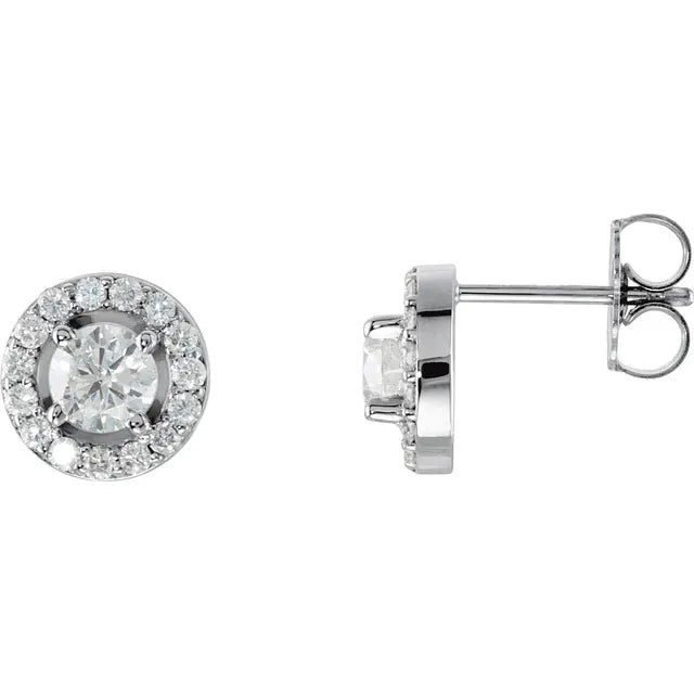 Pair of diamond halo stud earrings in white gold, on a white background.