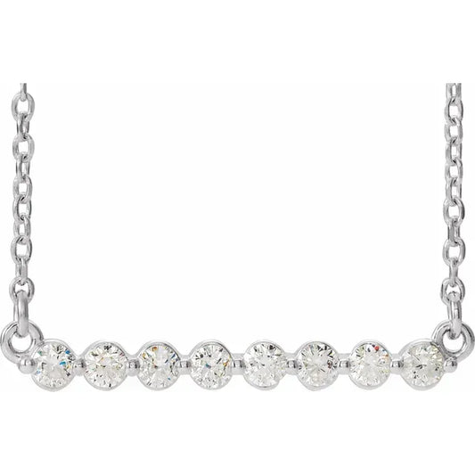 White gold necklace with a row of diamonds on a white background.