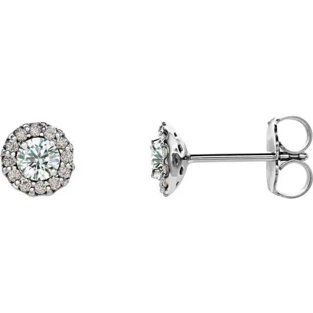 Pair of diamond halo stud earrings on a white background