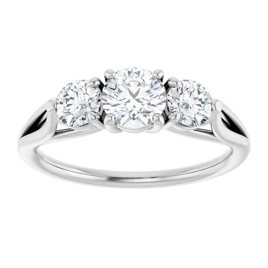 White gold three-stone diamond engagement ring on a white background.