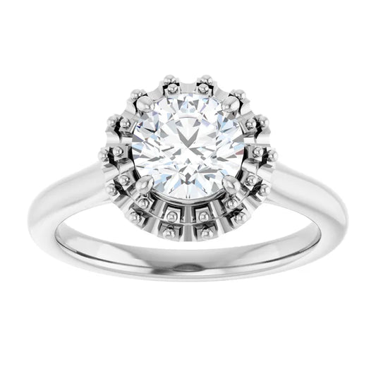 White gold diamond engagement ring with a halo setting on a white background.