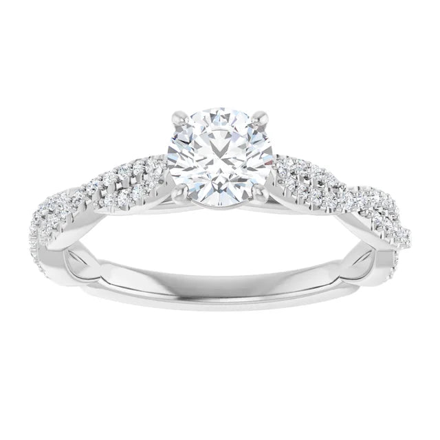 White gold diamond engagement ring with a twisted band on a white background.